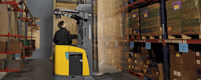 Man sitting in Reach Truck 