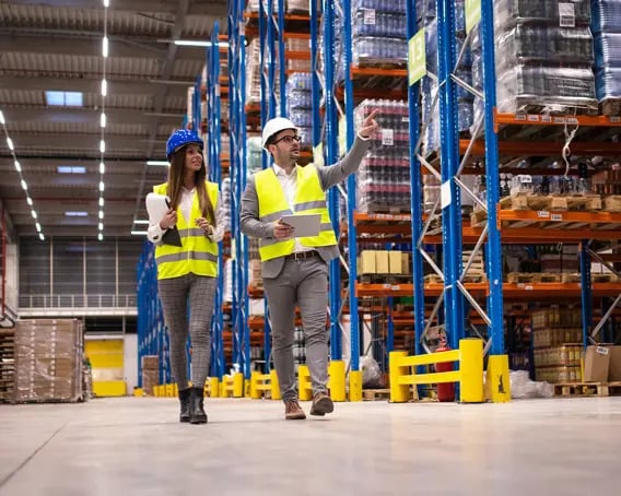 Technician helping a customer inside a warehouse