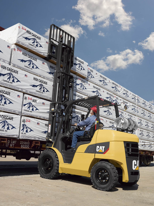 Close up view of man placing product outside with 8,000 – 12,000 lb. forklift