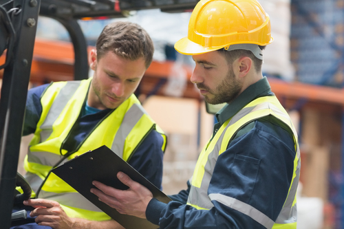 Vecteezy Focused Warehouse Workers Talking Together