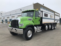 feature picture of 2022 Freightliner 114SD with 23' Block Body, Two 13,500 Steerable Pusher Axles, and a Navigator Forklift Package